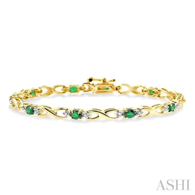 4x3mm Oval Cut Emerald and 1/10 Ctw Single Cut Diamond Tennis Bracelet in 10K Yellow Gold